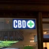 CBD Weed LED smoke shop sign closeup on store window