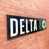 Smoke shop Delta 8 LED Retail ready sign against a red brick wall not lit