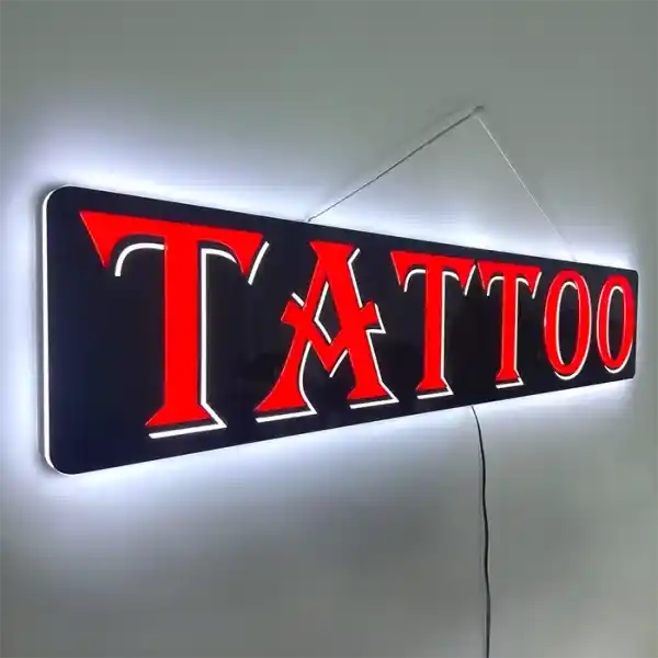 Tattoo LED Retail ready sign against a white wall lit at an angle