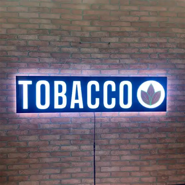 Smoke shop Tobacco LED Retail ready sign against a red brick wall