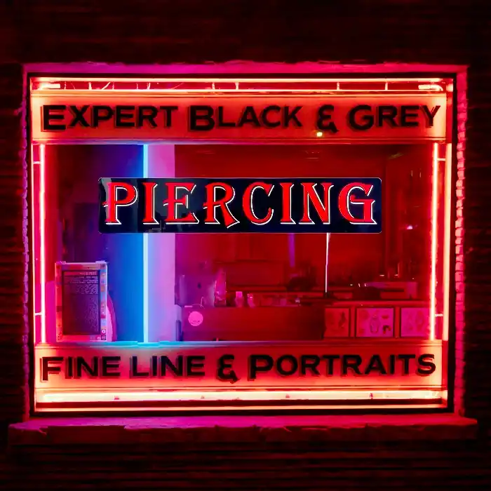 Piercing LED window tattoo Parlor sign hanging in a well lit window