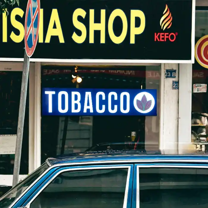 Tobaccos Shop sign LED with tobacco leaf design on a storefront